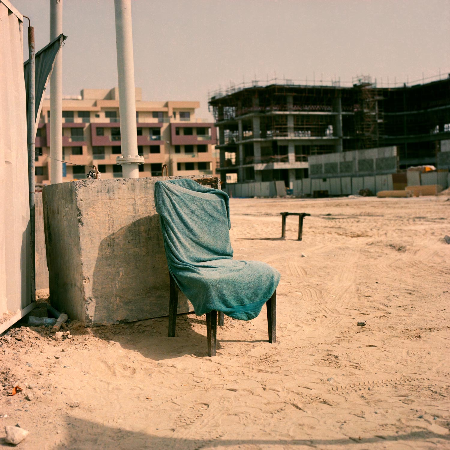 Towel covered chair at a construction site in Dubai.