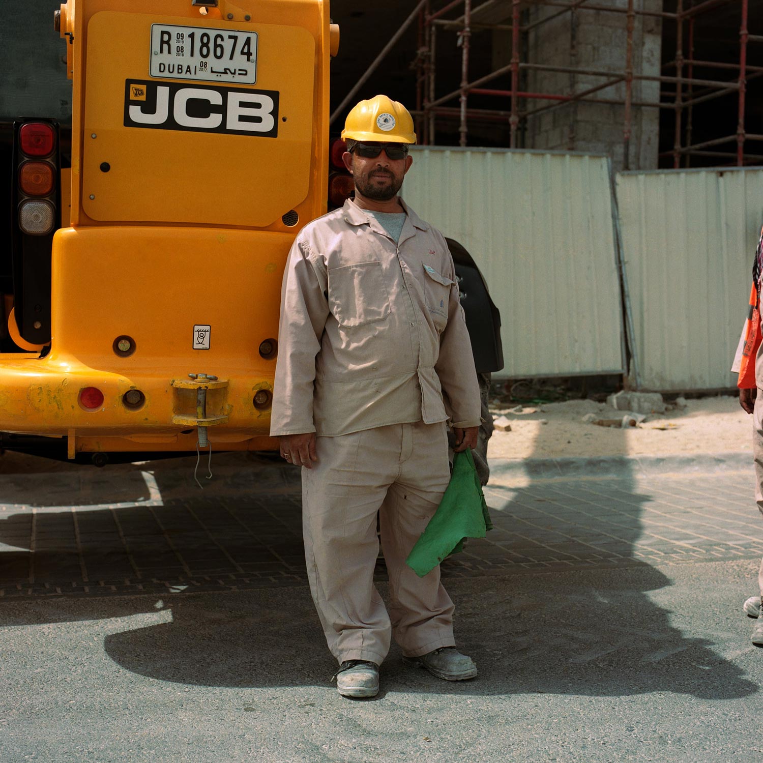 Construction worker in Dubai poses for a portrait, analogue photography.