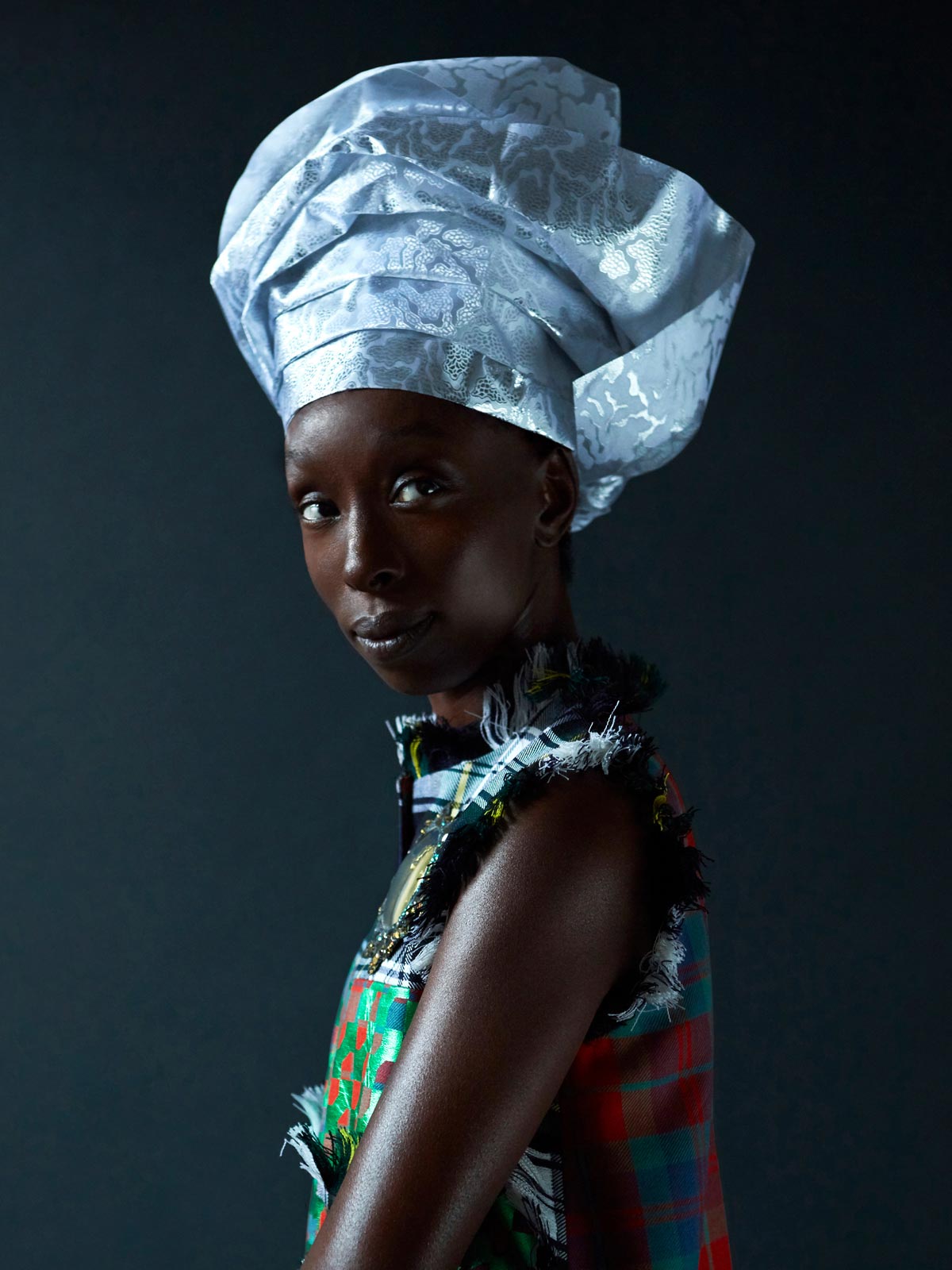 Woman with headpiece posing to camera, Eunice Olumide feature for Hunger Magazine.