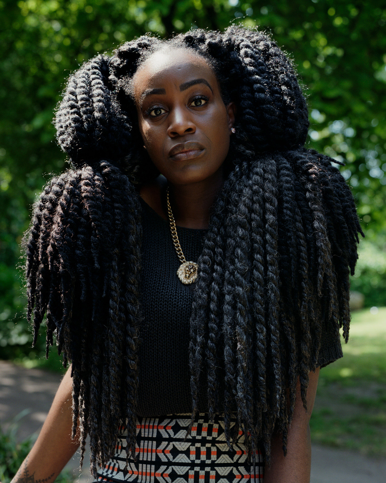 Ruby, Beautiful black woman with oversized jumbo braids, street photography.